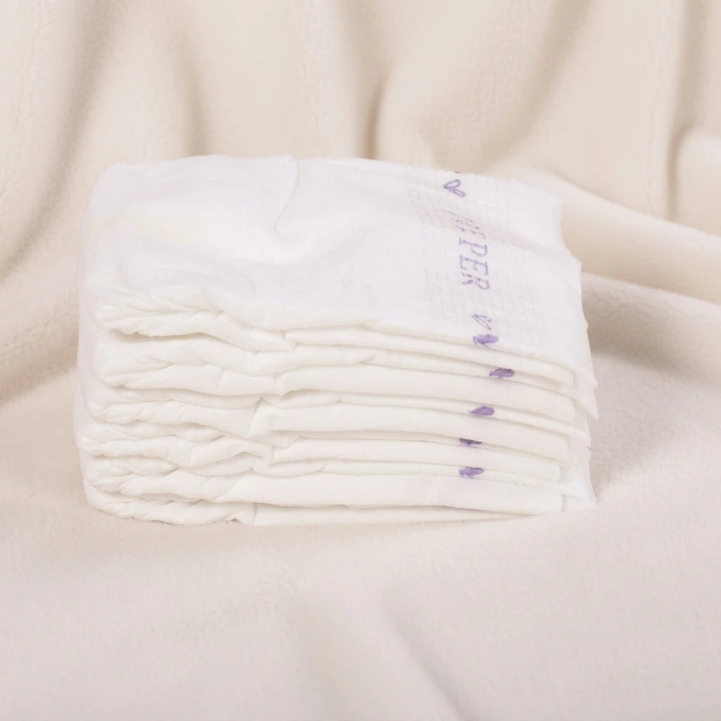 A stack of ultra-thin baby diapers showing a slim profile for lightweight comfort and easy travel